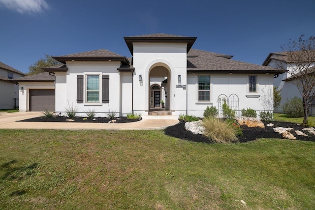 1924 Portobello Rd, Leander, TX 78641 - mediterranean / spanish-style home featuring stucco siding, an attached garage, a front yard, concrete driveway, and a shingled roof
