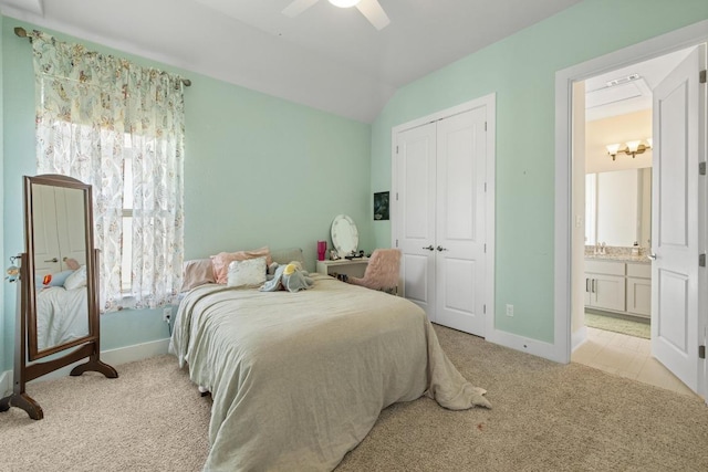 1924 Portobello Rd, Leander, TX 78641 - bedroom featuring carpet flooring, a closet, lofted ceiling, a ceiling fan, and connected bathroom