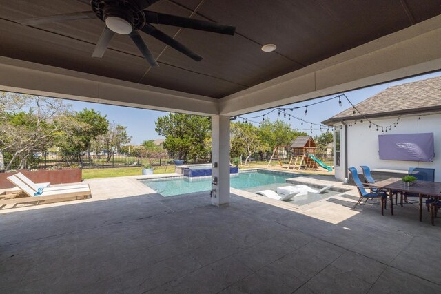 1924 Portobello Rd, Leander, TX 78641 - outdoor pool featuring a playground, a patio area, a ceiling fan, and outdoor dining space