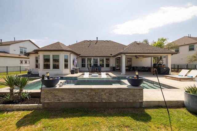 1924 Portobello Rd, Leander, TX 78641 - back of house featuring an in-ground hot tub, ceiling fan, a patio, an outdoor living space, and a shingled roof