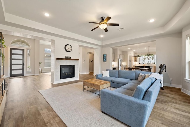 1924 Portobello Rd, Leander, TX 78641 - living room featuring a ceiling fan, wood finished floors, plenty of natural light, and recessed lighting