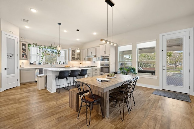 1924 Portobello Rd, Leander, TX 78641 - dining room featuring healthy amount of natural light, light wood-type flooring, and recessed lighting