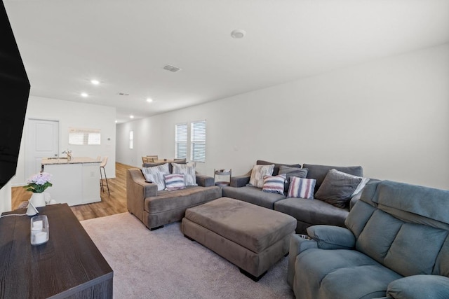 412 Gemsbok Rd, Hutto, TX 78634 - living room with healthy amount of natural light, recessed lighting, and light wood-style flooring