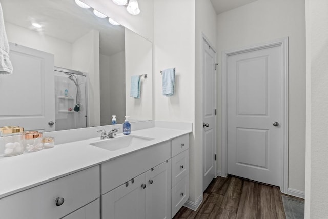 412 Gemsbok Rd, Hutto, TX 78634 - bathroom with vanity, wood finished floors, and a shower with shower door