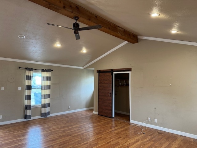 2100 Heights Blvd, Taylor, TX 76574 - spare room featuring ceiling fan, a barn door, wood finished floors, recessed lighting, and ornamental molding