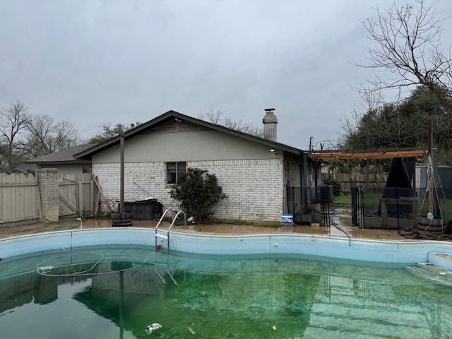 2100 Heights Blvd, Taylor, TX 76574 - view of swimming pool with a gate