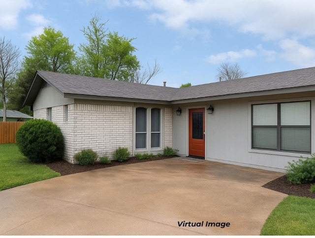 2100 Heights Blvd, Taylor, TX 76574 - ranch-style home with a patio area, roof with shingles, and brick siding