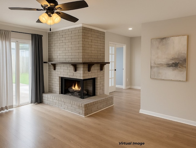 2100 Heights Blvd, Taylor, TX 76574 - unfurnished living room featuring wood finished floors, recessed lighting, a fireplace, and ceiling fan