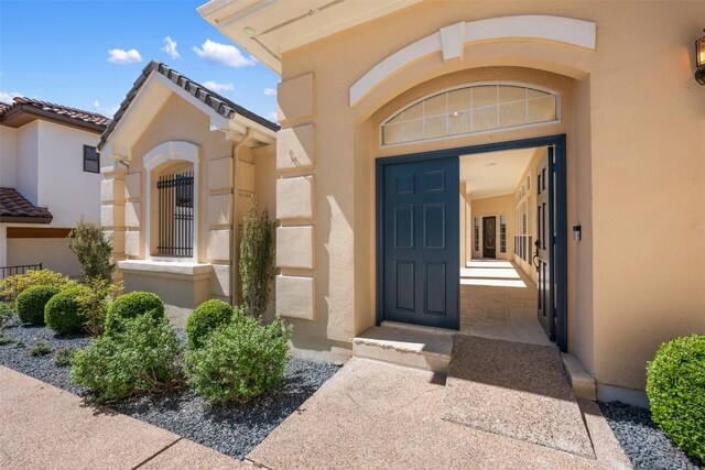 6 Radnor Dr, Austin, TX 78738 - view of exterior entry featuring stucco siding
