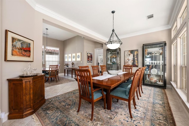 6 Radnor Dr, Austin, TX 78738 - dining room featuring light tile patterned floors, ornamental molding, baseboards, and a chandelier