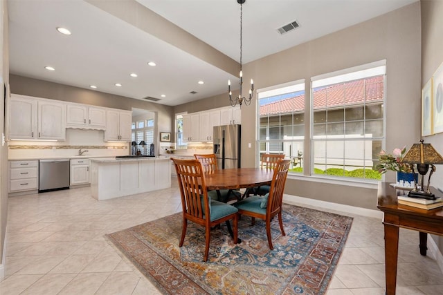 6 Radnor Dr, Austin, TX 78738 - dining space with light tile patterned floors, recessed lighting, and baseboards
