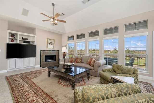6 Radnor Dr, Austin, TX 78738 - living area with a ceiling fan, a high ceiling, a fireplace, baseboards, and recessed lighting