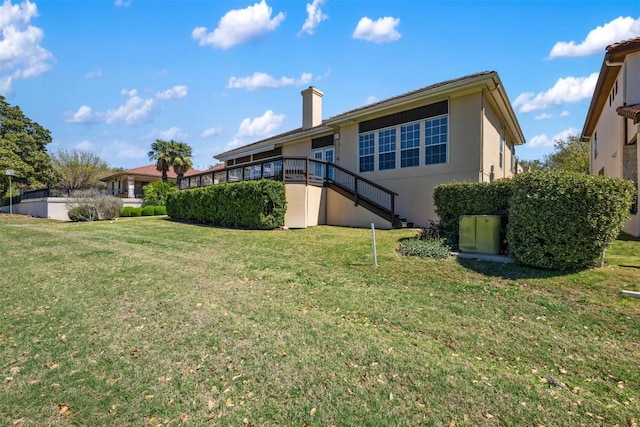 6 Radnor Dr, Austin, TX 78738 - back of property featuring stairs, stucco siding, a yard, and a chimney