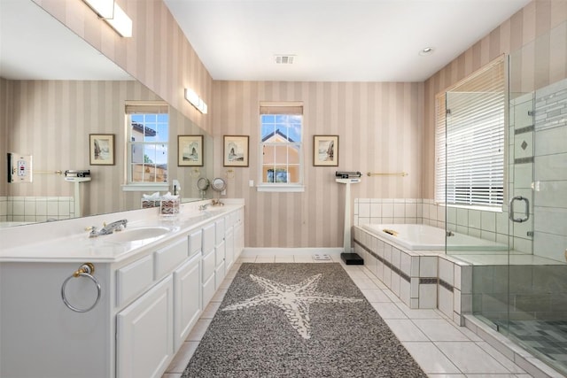 6 Radnor Dr, Austin, TX 78738 - bathroom featuring wallpapered walls, tile patterned flooring, a garden tub, plenty of natural light, and double vanity