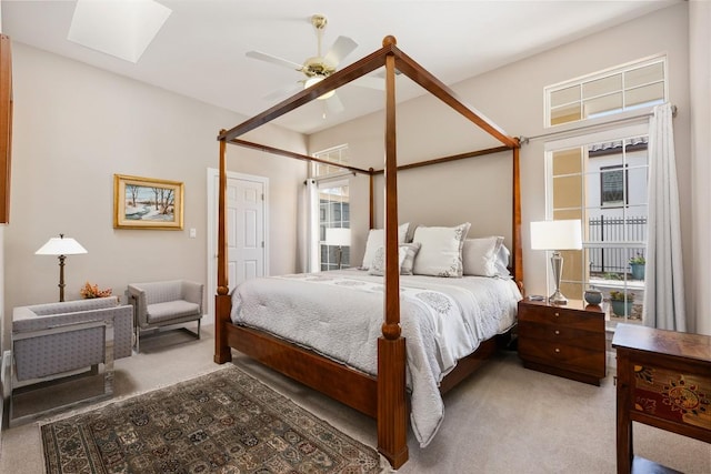 6 Radnor Dr, Austin, TX 78738 - carpeted bedroom featuring a skylight, multiple windows, and a ceiling fan