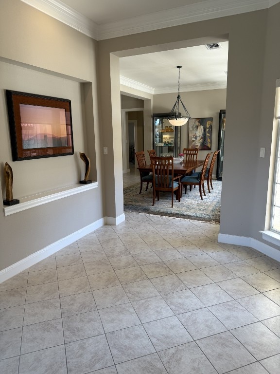 6 Radnor Dr, Austin, TX 78738 - dining space featuring crown molding, light tile patterned floors, and baseboards