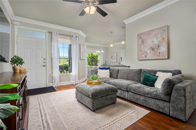 7701 Rialto Blvd Unit 617, Austin, TX 78735 - living area with ornamental molding, dark wood finished floors, a chandelier, a ceiling fan, and baseboards