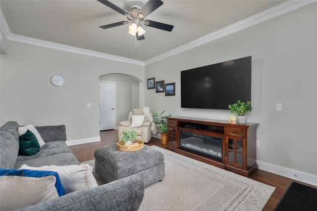 7701 Rialto Blvd Unit 617, Austin, TX 78735 - living room with arched walkways, crown molding, ceiling fan, wood finished floors, and baseboards