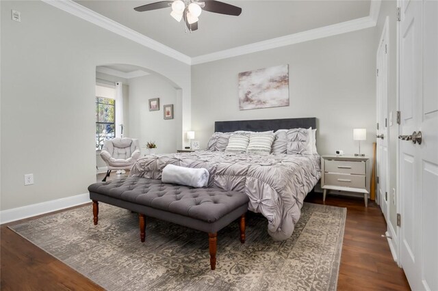 7701 Rialto Blvd Unit 617, Austin, TX 78735 - bedroom featuring arched walkways, dark wood finished floors, crown molding, baseboards, and ceiling fan