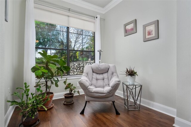 7701 Rialto Blvd Unit 617, Austin, TX 78735 - sitting room featuring crown molding, baseboards, and dark wood-style floors