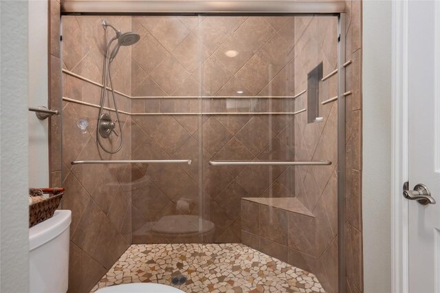7701 Rialto Blvd Unit 617, Austin, TX 78735 - full bathroom featuring toilet and a shower stall