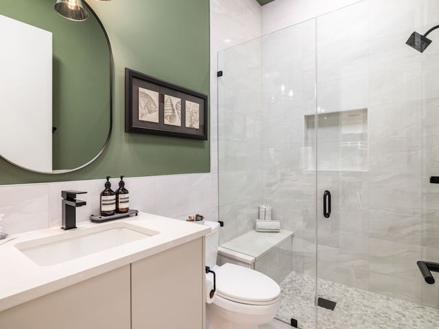 1510 Bellaire Dr, Austin, TX 78741 - full bath featuring tile walls, vanity, and a stall shower