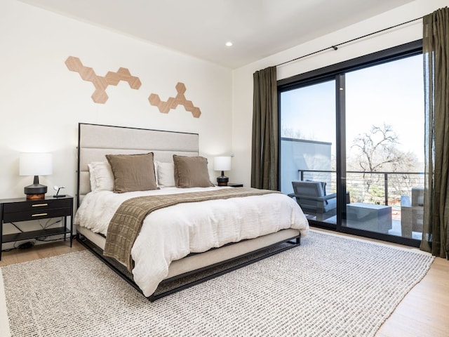 1510 Bellaire Dr, Austin, TX 78741 - bedroom with wood finished floors, access to exterior, multiple windows, and recessed lighting