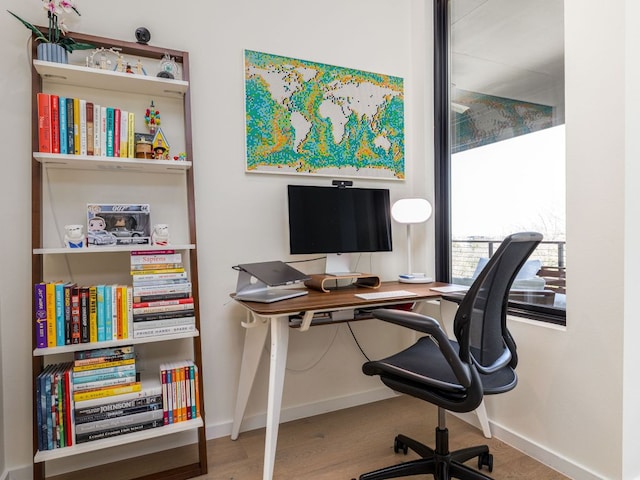 1510 Bellaire Dr, Austin, TX 78741 - office area with baseboards and wood finished floors
