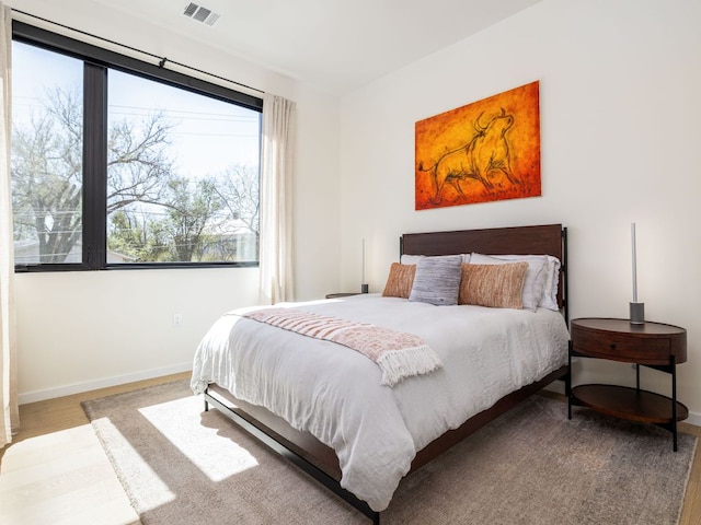 1510 Bellaire Dr, Austin, TX 78741 - bedroom with baseboards and wood finished floors