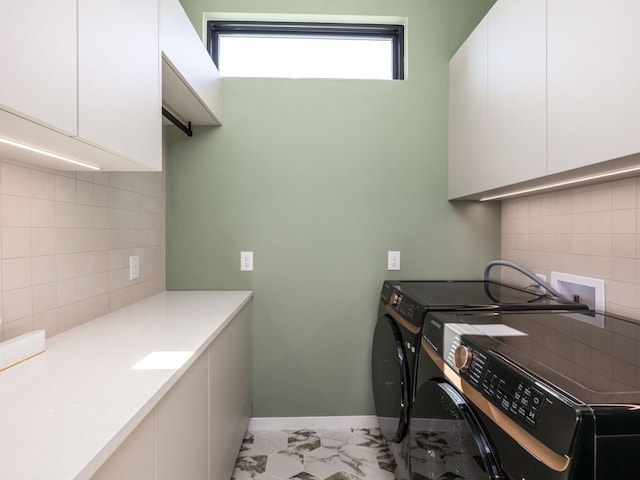 1510 Bellaire Dr, Austin, TX 78741 - laundry area with cabinet space, separate washer and dryer, and light marble finish floors