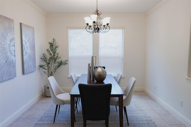 dining space with light tile patterned floors, baseboards, an inviting chandelier, and crown molding