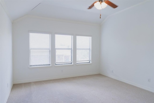 empty room featuring light carpet, baseboards, vaulted ceiling, and ceiling fan