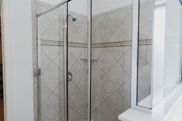 full bath featuring a shower stall