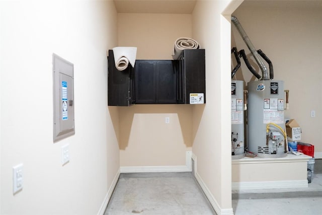 interior space with water heater, baseboards, and concrete flooring