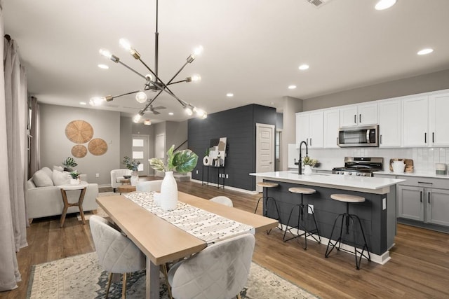 7800 Linnie Ln, Austin, TX 78724 - dining space with recessed lighting, a chandelier, and wood finished floors