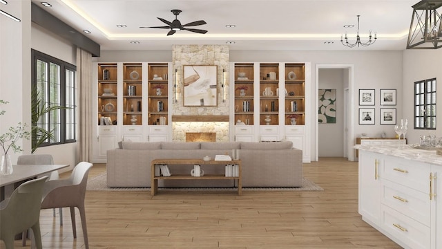 LOT47 E Flying Owl Dr, Johnson City, TX 78636 - living room with a tray ceiling, ceiling fan, light wood-type flooring, and a wealth of natural light