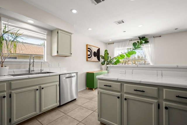 1302 Rambling Trl, Cedar Park, TX 78613 - kitchen featuring stainless steel dishwasher, a sink, light countertops, light tile patterned floors, and recessed lighting