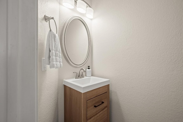 1302 Rambling Trl, Cedar Park, TX 78613 - bathroom with vanity and a textured wall