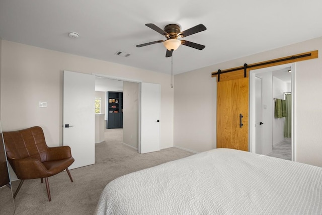 1302 Rambling Trl, Cedar Park, TX 78613 - bedroom featuring light carpet, a barn door, a ceiling fan, and baseboards