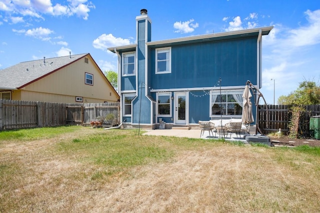 1302 Rambling Trl, Cedar Park, TX 78613 - back of house featuring a patio area and a chimney