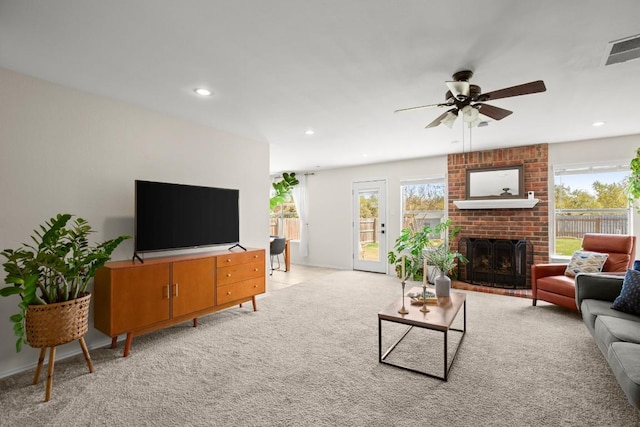 1302 Rambling Trl, Cedar Park, TX 78613 - living area featuring a ceiling fan, recessed lighting, a brick fireplace, and light colored carpet