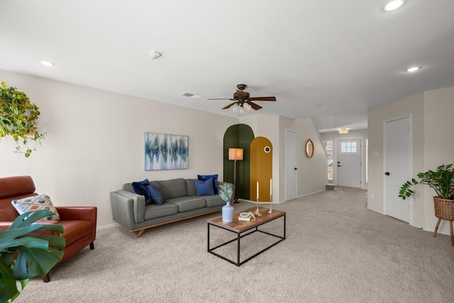 1302 Rambling Trl, Cedar Park, TX 78613 - living room featuring light colored carpet, a ceiling fan, recessed lighting, baseboards, and arched walkways