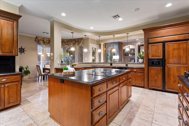 1317 Jack Nicklaus Cir, Salado, TX 76571 - kitchen featuring visible vents, crown molding, brown cabinets, paneled built in refrigerator, and a sink