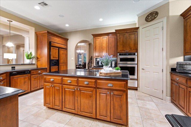 1317 Jack Nicklaus Cir, Salado, TX 76571 - kitchen with visible vents, dark countertops, double oven, and a kitchen island