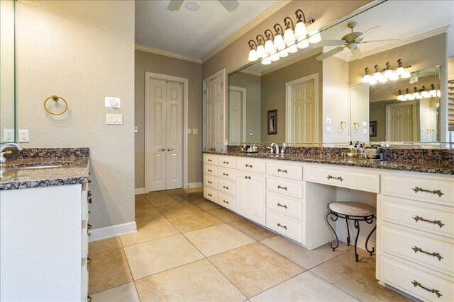1317 Jack Nicklaus Cir, Salado, TX 76571 - full bath with tile patterned flooring, vanity, crown molding, baseboards, and a ceiling fan