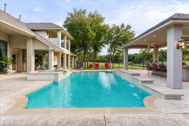 1317 Jack Nicklaus Cir, Salado, TX 76571 - view of pool featuring fence, ceiling fan, a pool with connected hot tub, and a patio area