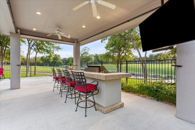 1317 Jack Nicklaus Cir, Salado, TX 76571 - view of patio / terrace with outdoor wet bar, fence, and ceiling fan