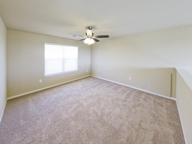 12110 Stoneridge Gap Ln, Manor, TX 78653 - unfurnished room featuring carpet floors, ceiling fan, and baseboards