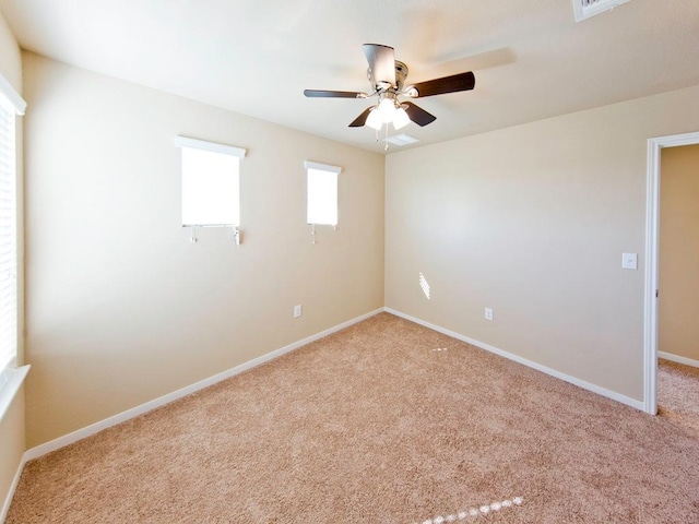 12110 Stoneridge Gap Ln, Manor, TX 78653 - unfurnished room with light colored carpet, ceiling fan, and baseboards