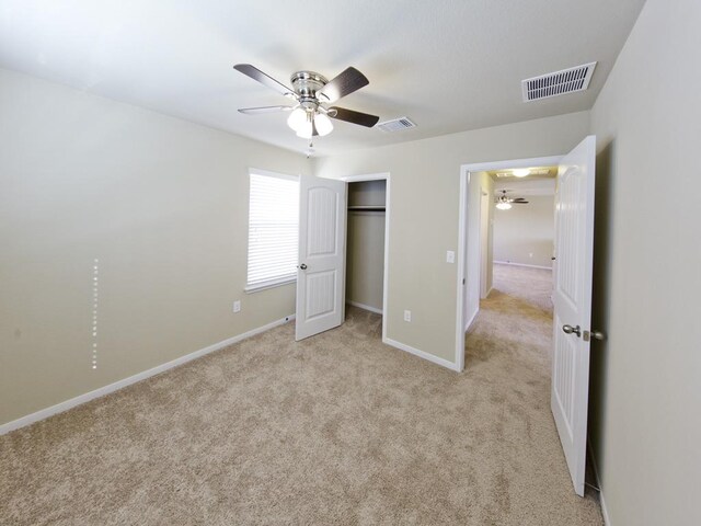 12110 Stoneridge Gap Ln, Manor, TX 78653 - unfurnished bedroom featuring light colored carpet, baseboards, a closet, and ceiling fan